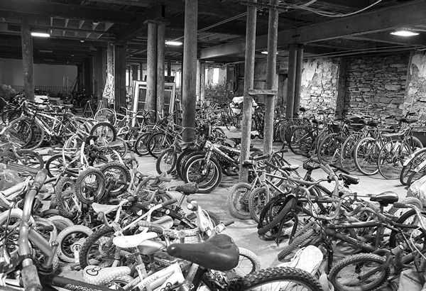 Dozens of cast-off bicycles are gathered in one room at the Old Stone Mill Center for Arts and Creative Engineering. After repairs and modifications, most will be shipped to countries in Africa to provide basic transportation. Susan Sabino photo Dozens of cast-off bicycles are gathered in one room at the Old Stone Mill Center for Arts and Creative Engineering. After repairs and modifications, most will be shipped to countries in Africa to provide basic transportation. Susan Sabino photo