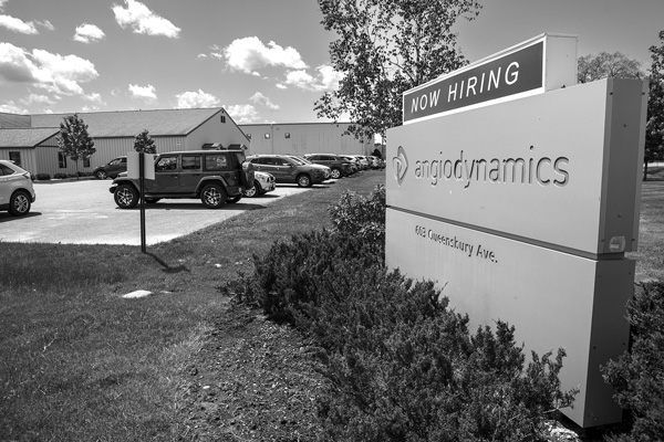 The sign outside AngioDynamics' medical device plant in Queensbury, N.Y., says the company is now hiring, but the factory is set to shut down at the end of 2025. Employee shortages are one reason the company has cited for its decision to close its local plants and outsource all of its manufacturing. All photos by Joan K. Lentini. The sign outside AngioDynamics' medical device plant in Queensbury, N.Y., says the company is now hiring, but the factory is set to shut down at the end of 2025. Employee shortages are one reason the company has cited for its decision to close its local plants and outsource all of its manufacturing. All photos by Joan K. Lentini.