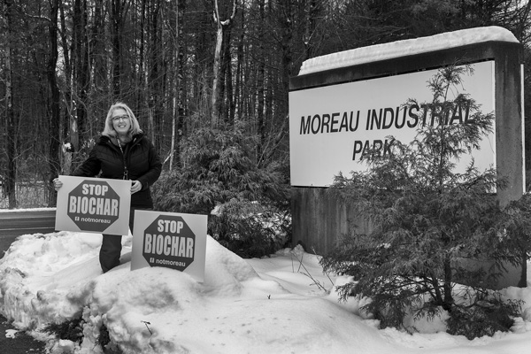 Gina LeClair holds signs opposing construction of the Saratoga Biochar Solutions facility that’s planned for a site at the Moreau Industrial Park in northern Saratoga County. Joan K. Lentini photo Gina LeClair holds signs opposing construction of the Saratoga Biochar Solutions facility that’s planned for a site at the Moreau Industrial Park in northern Saratoga County. Joan K. Lentini photo