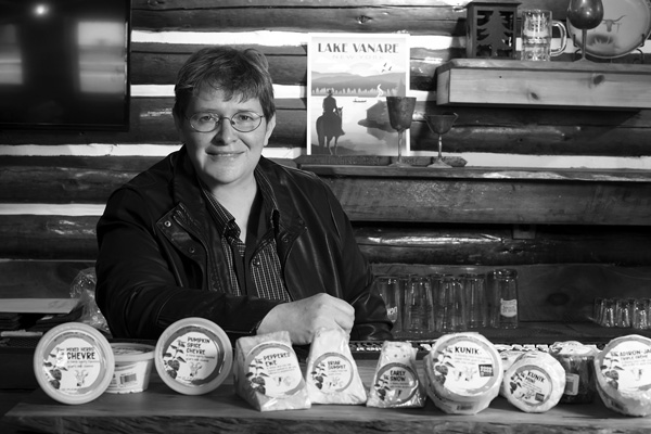Co-owner Sheila Flanagan displays some of the varieties of Nettle Meadow cheeses at the artisan producer’s new facility in Lake Luzerne, N,Y. Joan K. Lentini photo Co-owner Sheila Flanagan displays some of the varieties of Nettle Meadow cheeses at the artisan producer’s new facility in Lake Luzerne, N,Y. Joan K. Lentini photo