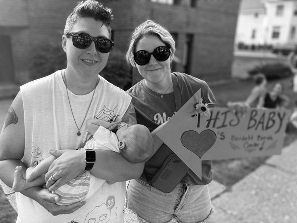 Emily Steinbach, right, her wife, Michele, and daughter Eleanor take part in a rally last month against the proposed closing of Burdett Birth Center, the only remaining medical facility in Rensselaer County where expectant mothers can give birth. Victoria Kereszi photo Emily Steinbach, right, her wife, Michele, and daughter Eleanor take part in a rally last month against the proposed closing of Burdett Birth Center, the only remaining medical facility in Rensselaer County where expectant mothers can give birth. Victoria Kereszi photo