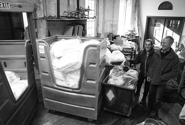 In one of their projects, Leni Fried and Mike Augspurger have collected more than 90 tons of fabric cast off by a local linen service, thereby keeping it out of an incinerator and instead redirecting it to local nonprofits and to communities overseas. Susan Sabino photo In one of their projects, Leni Fried and Mike Augspurger have collected more than 90 tons of fabric cast off by a local linen service, thereby keeping it out of an incinerator and instead redirecting it to local nonprofits and to communities overseas. Susan Sabino photo